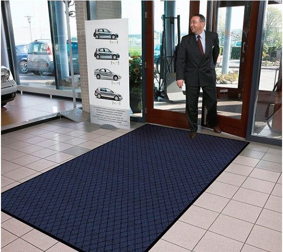 Evergreen Diamond 3 Floormat.com Evergreen Diamond™ features a fashionable diamond pattern design made from 100% recycled carpet fibers. A hefty 25 ounce per square yard tufted loop pile top surface allows the mat to capture debris and moisture while maintaining its attractive appearance. A heavyweight vinyl non-slip backing ensures minimum movement. <ul> <li>Carpet fibers made from 100% recycled material</li> <li>25 ounce tufted loop pile carpet for increased moisture retention</li> <li>3/8 inch overall thickness for use in narrow clearance doorways</li> <li>Vinyl backing helps reduce mat movement</li> </ul>