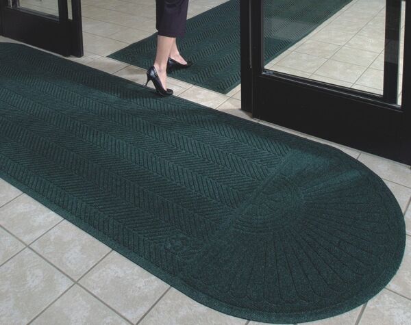 Waterhog Eco Grand Elite 2 Floormat.com Entrance Scraper-Wiper Indoor or Outdoor Matting <ul> <li>Earth friendly 30 oz. sq/yd 100% post consumer recycled PET fabric from plastic bottles</li> <li>3/8” thick bi-level surface effectively removes and stores dirt and moisture beneath shoe level</li> <li>Unique “Water Dam” allows the Waterhog mat to hold up to 1 1/2 gallons of water per sq yard</li> </ul> <h2>Eco-friendly & Luxury Carpet Matting</h2> Made of 100% Post-Consumer Recycled PET Polyester reclaimed from plastic drink bottles, this attractive new mat combines years of WaterHog bi-level cleaning technology with the most unique design concept ever! Who said a mat has to look like a "door mat?" Not anymore with these attractive diamond pattern mats! Great for Malls, Banks, Hotels Offices, Restaurants, Healthcare, Supermarkets, and more! <b>Andersen Waterhog Eco Grand Premier Benefits:</b> <ul> <li>Face fabric is heavy 30 oz./sq. yd. 100% Post-Consumer Recycled PET Polyester reclaimed from plastic drink bottles</li> <li>Eight Attractive Colors in Diamond Pattern</li> <li>New Fashion Borders</li> <li>Large Selection of Sizes</li> <li>Smooth or Special Tri-Grip Cleated Back to Minimize Movement; SBR Rubber with 15% post-consumer recycled tires</li> </ul> <img class="size-full wp-image-14977 alignleft" src="https://www.floormat.com/wp-content/uploads/eco-roll-colors.jpg" alt="" width="430" height="62" />   <b>Eco Grand Premier Color Options</b> Color Key: Black Smoke, Grey Ash, Southern Pine, Indigo, Khaki, Chestnut Brown, Maroon, Regal Red