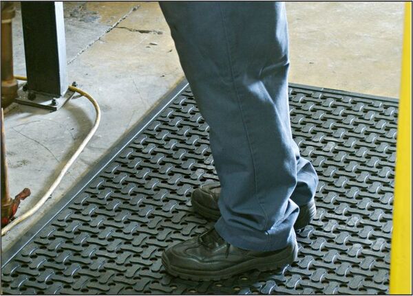cf industrial Floormat.com Anti-fatigue, slip resistant mats for dry or wet environments indoors or outdoors, with or without grit. <strong>Anti-fatigue, slip resistant mats for kitchens and industrial applications.</strong> These durable mats come in a standard nitrile rubber version, or with an aggressive, silicon carbide anti-slip top surface. The mats feature: <ul> <li>High Density Closed Cell Nitrile Rubber Cushion has 15% recycled content</li> <li>Grease and oil proof, chemical resistant</li> <li>Static Dissipative and certified slip resistant by National</li> <li>Floor Safety Institute</li> <li>Welding Safe</li> <li>Beveled edges for safe transition from mat to floor</li> <li>Lifetime anti-microbial treatment to prevent odors and degradation of the mat</li> <li>Comfort Flow has drainage holes to allow liquids to flow through. Comfort Scrape has non-draining surface</li> <li>Light weight and flexible for easy handling and cleaning</li> <li>Recommended for kitchens and industrial applications</li> </ul> <img class="wp-image-15053 size-medium aligncenter" src="https://www.floormat.com/wp-content/uploads/comfort-flow-surface-300x231.jpg" width="300" height="231" />