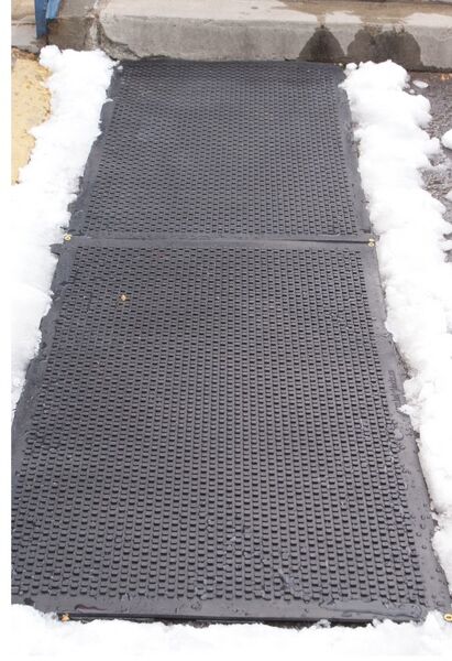 hot blocks door landing mat 2 1 Floormat.com <h1 style="text-align: center;">Temporarily Unavailable</h1> <h2 style="text-align: center;"><a href="https://www.floormat.com/melt-step-snow-melting-mat/">Try Our Melt Step Snow Melting Mat Instead</a></h2> Avoid the hazardous fall on the ice this winter! The HOT-blocks™ outdoor industrial heated mats have been designed for keeping stairs, doorways, handicapped ramps, walkways and alleyways safe and ice free!<b> </b>They are safe and secure from accidents due to slipping and falling. They melt snow and ice on contact. The HOT-blocks™ outdoor heated mats are designed to withstand harsh winter conditions. <b>(GFCI Power Cord not included.)</b> <ul> <li>These mats are Eco friendly, inter-connectable, and versatile.</li> <li>100% Virgin Rubber</li> <li>Dimensions: 36" L x 24" W x 0.31" H</li> <li>Weight: 18 lbs</li> </ul>