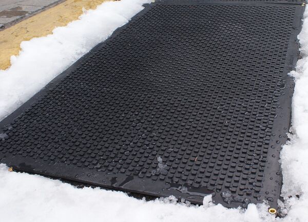 hot blocks stair treads 02 Floormat.com <h1 style="text-align: center;">Temporarily Unavailable</h1> <h2 style="text-align: center;"><a href="https://www.floormat.com/melt-step-snow-melting-mat/">Try Our Melt Step Snow Melting Mat Instead</a></h2> Dry, safer footing at your entrances. <b>(GFCI Power Cord not included.)</b> <ul> <li>UV Protected anti-slip heated rubber mats are built tough and solid enough to be used on driveways, and high traffic areas.</li> <li>All HOT-blocks mats have waterproof, inter-connectable screw type connectors, to prevent water infiltration.</li> <li>GFCI Power Cord not included.</li> </ul> <h2>Heated Carpet Mats Melt Snow & Ice w/o Shoveling or Chemicals</h2>   Our industrial-quality, snow melting entrance mat is an electrically heated carpet mat designed to prevent snow and ice accumulation around your facility's entryway. The mat is constructed with heavy duty weatherproof olefin fiber so it can endure the harshest of winter elements while providing your facility with the look of a sleek, carpeted entrance mat. The Entrance Mat plugs into any standard 120V outlet generating heat to melt snow at a rate of 2 inches per hour. The ribbed carpet surface captures salt and dirt from the bottoms of shoes, so you can prevent dangerous slip and fall accidents outside your facility, while keeping the mess from being tracked inside. Turn the mat on before or after a snow fall and watch the mat melt snow on contact--no more shoveling, salting, or slipping! Logo printing is available (please call us). Choose from three sizes to meet the needs of most commercial entrances – 24 in. x 36 in., 30 in. x 48 in. or 40 in. x 60 in. <b>HeatTrak Snow Melting Carpet Mat Specifications</b>: <ul> <li>Color: Black</li> <li>Surface Material: High UV Olefin Fiber</li> <li>Cord Length: 6 Foot</li> <li>Warranty: 2 Years</li> <li>Total Thickness: 0.5 inches</li> </ul> <b>Snow Melting Carpet Mats</b>